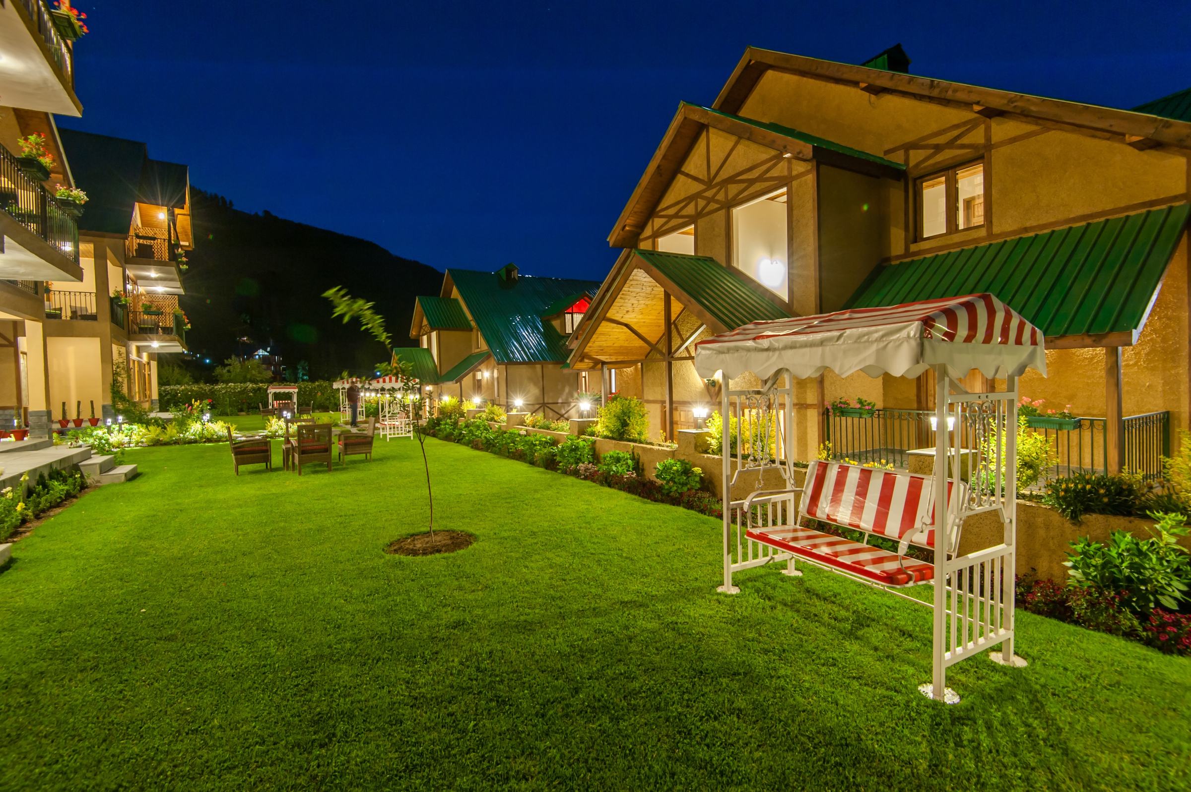 The villas and gardens lit up at dusk